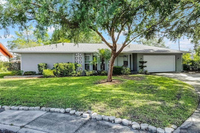 7201 Pleasant Dr, Orlando, FL 32818 - ranch-style home featuring stucco siding, an attached garage, a front yard, and driveway