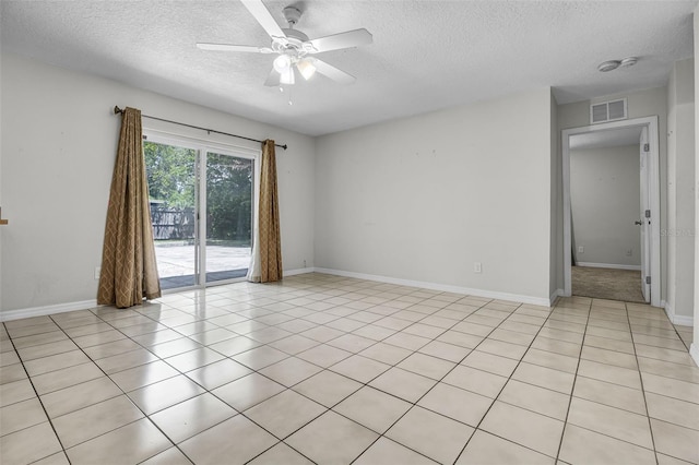 7201 Pleasant Dr, Orlando, FL 32818 - spare room featuring a textured ceiling, ceiling fan, and light tile patterned floors