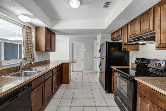 7201 Pleasant Dr, Orlando, FL 32818 - kitchen featuring black appliances, under cabinet range hood, a tray ceiling, a textured ceiling, and light tile patterned floors