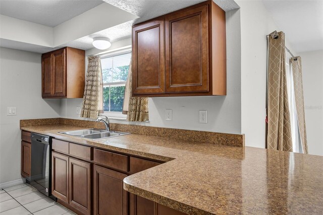 7201 Pleasant Dr, Orlando, FL 32818 - kitchen featuring dishwasher, light tile patterned floors, and dark countertops