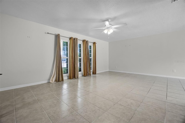 7201 Pleasant Dr, Orlando, FL 32818 - empty room featuring ceiling fan, light tile patterned floors, and a textured ceiling