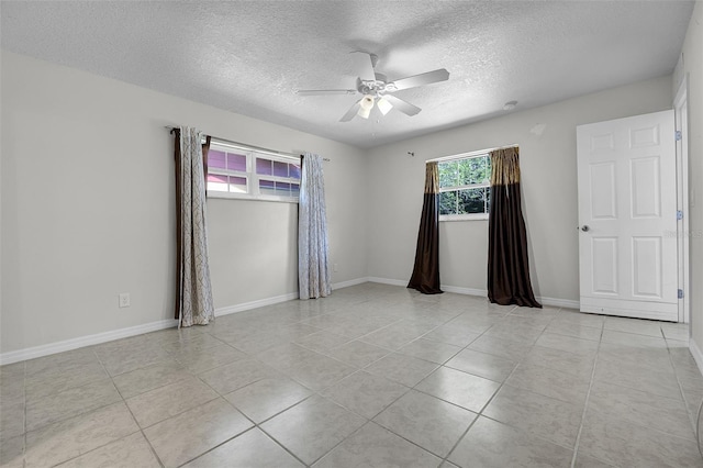 7201 Pleasant Dr, Orlando, FL 32818 - spare room with a ceiling fan, a textured ceiling, and light tile patterned floors