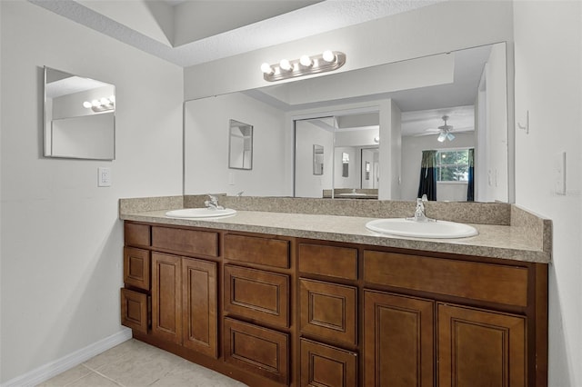 7201 Pleasant Dr, Orlando, FL 32818 - full bath featuring double vanity, ceiling fan, and tile patterned floors