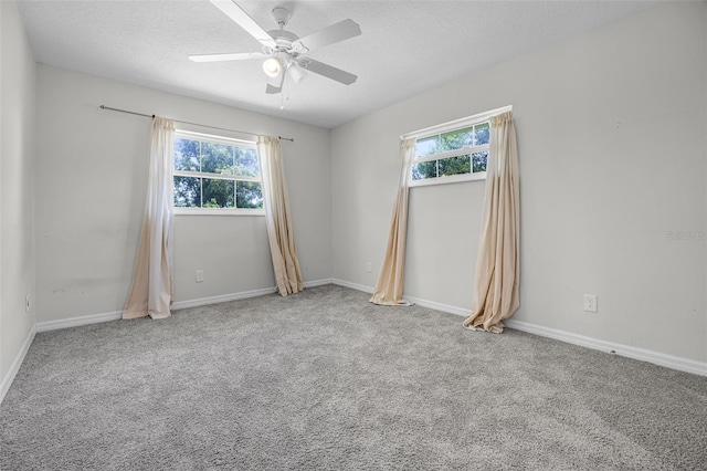 7201 Pleasant Dr, Orlando, FL 32818 - carpeted spare room featuring plenty of natural light, a ceiling fan, and a textured ceiling