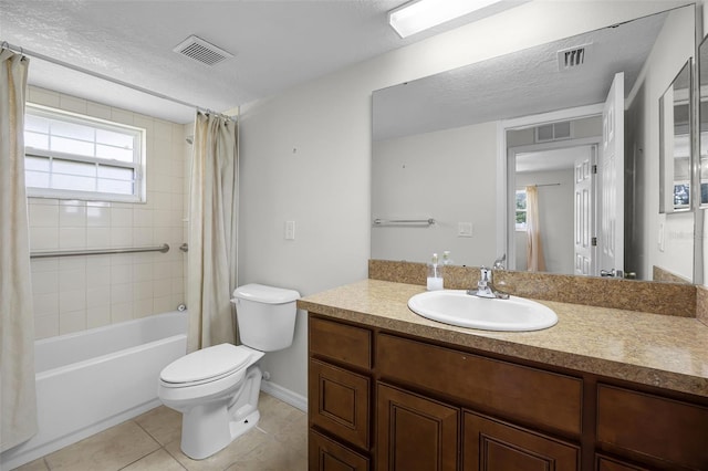 7201 Pleasant Dr, Orlando, FL 32818 - bathroom with vanity, tile patterned floors, shower / tub combo, and a textured ceiling