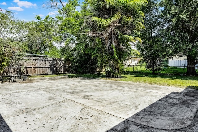 7201 Pleasant Dr, Orlando, FL 32818 - fenced backyard with a patio area