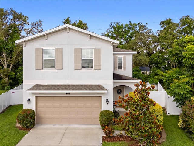 2556 Ocoee Reserve Ct, Ocoee, FL 34761 - view of front of property with a shingled roof, concrete driveway, a garage, and stucco siding