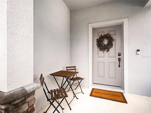 2556 Ocoee Reserve Ct, Ocoee, FL 34761 - view of exterior entry featuring stucco siding