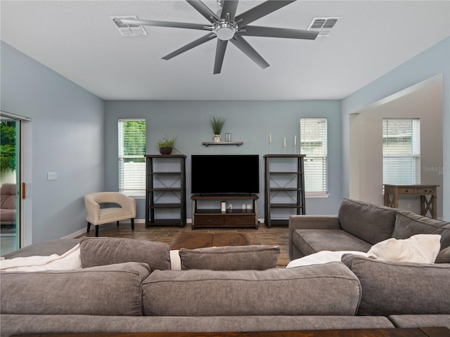 2556 Ocoee Reserve Ct, Ocoee, FL 34761 - living room featuring plenty of natural light and ceiling fan
