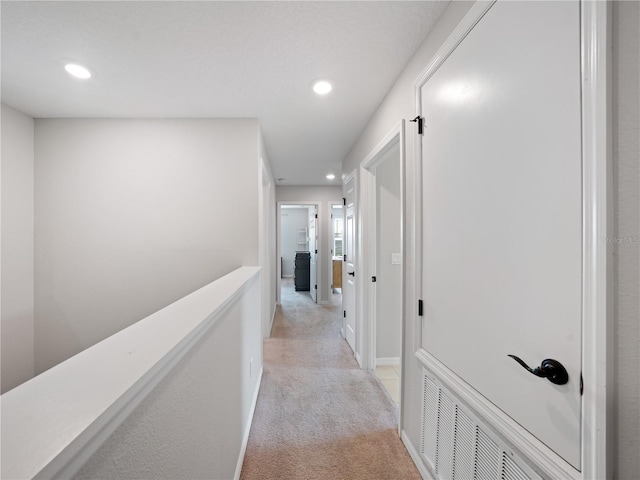2556 Ocoee Reserve Ct, Ocoee, FL 34761 - hall with light colored carpet and recessed lighting