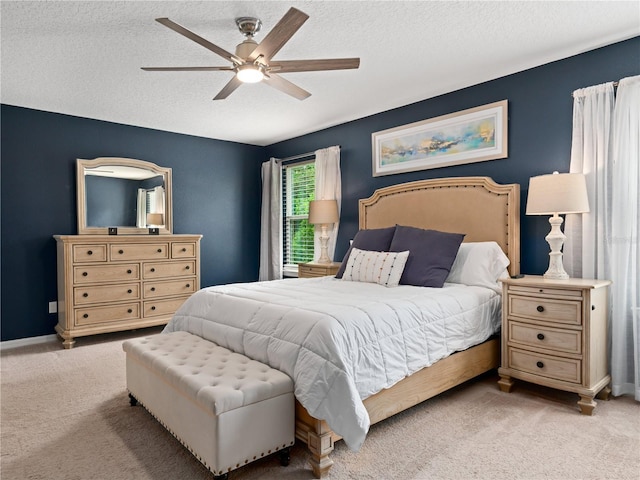 2556 Ocoee Reserve Ct, Ocoee, FL 34761 - bedroom with carpet flooring, a textured ceiling, and a ceiling fan