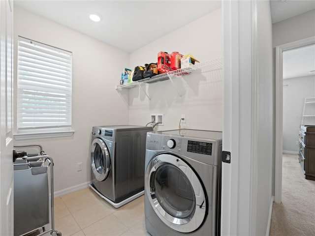 2556 Ocoee Reserve Ct, Ocoee, FL 34761 - laundry room with washer and dryer and baseboards