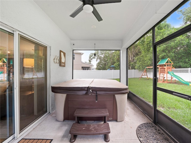2556 Ocoee Reserve Ct, Ocoee, FL 34761 - sunroom with a hot tub and ceiling fan
