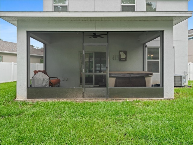 2556 Ocoee Reserve Ct, Ocoee, FL 34761 - rear view of property featuring a sunroom, stucco siding, and ceiling fan