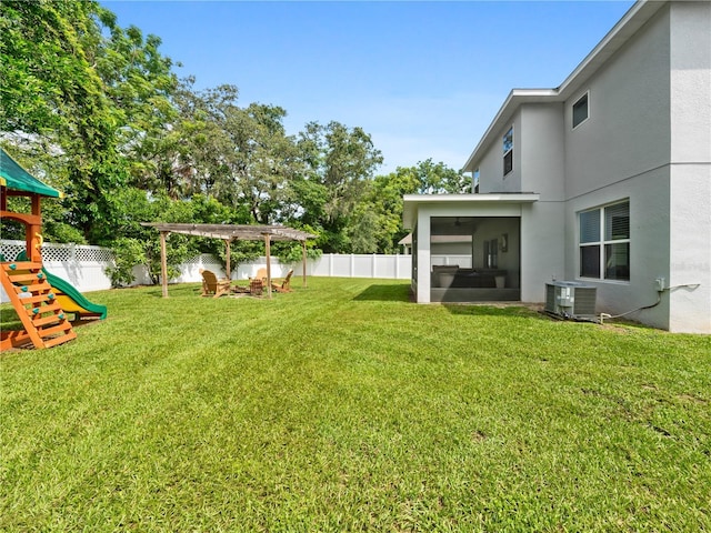 2556 Ocoee Reserve Ct, Ocoee, FL 34761 - fenced backyard featuring a sunroom, a playground, and a pergola
