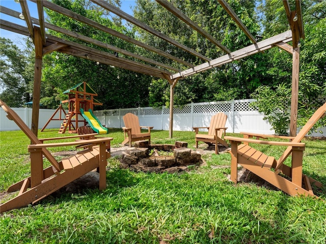 2556 Ocoee Reserve Ct, Ocoee, FL 34761 - fenced backyard featuring a playground and a pergola