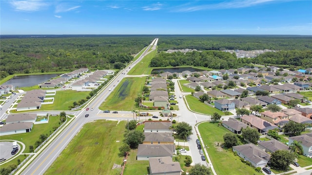 1514 Tamarind Rd, Davenport, FL 33896 - aerial overview of property's location with nearby suburban area and a large body of water
