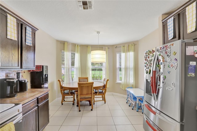 1514 Tamarind Rd, Davenport, FL 33896 - dining space with baseboards and light tile patterned flooring
