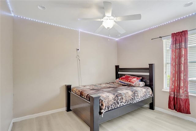 1514 Tamarind Rd, Davenport, FL 33896 - bedroom with wood finished floors and ceiling fan