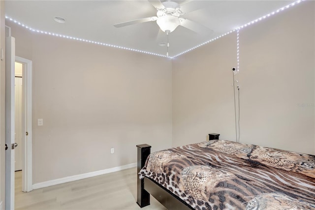 1514 Tamarind Rd, Davenport, FL 33896 - bedroom with baseboards and light wood-style flooring