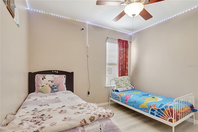 1514 Tamarind Rd, Davenport, FL 33896 - bedroom featuring wood finished floors and a ceiling fan