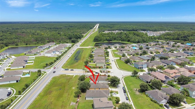 1514 Tamarind Rd, Davenport, FL 33896 - aerial overview of property's location with nearby suburban area and a nearby body of water