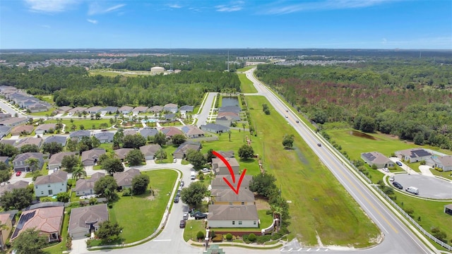 1514 Tamarind Rd, Davenport, FL 33896 - aerial overview of property's location with nearby suburban area and a forest