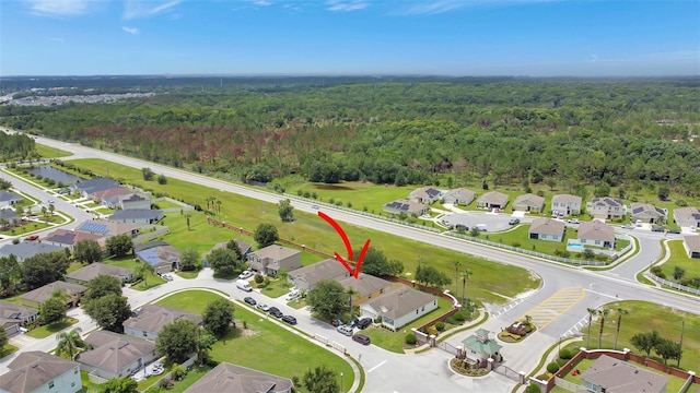 1514 Tamarind Rd, Davenport, FL 33896 - aerial view of property and surrounding area with a forest and nearby suburban area