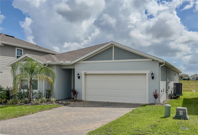 7484 Catania Loop, Clermont, FL 34714 - view of front of house with stucco siding, decorative driveway, a front lawn, and an attached garage
