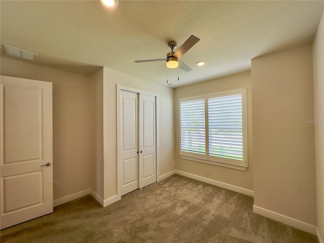 7484 Catania Loop, Clermont, FL 34714 - unfurnished bedroom with a closet, carpet floors, a ceiling fan, recessed lighting, and a textured ceiling
