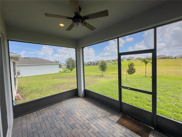 7484 Catania Loop, Clermont, FL 34714 - unfurnished sunroom with ceiling fan