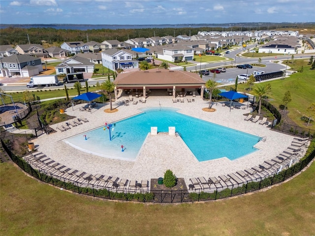 7484 Catania Loop, Clermont, FL 34714 - community pool featuring a patio and a residential view