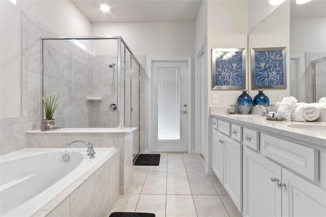 2026 Lelani Cir, Davenport, FL 33897 - bathroom with a stall shower, double vanity, a garden tub, and tile patterned flooring