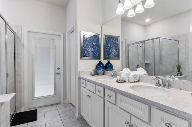 2026 Lelani Cir, Davenport, FL 33897 - bathroom with a chandelier, double vanity, a stall shower, and tile patterned flooring