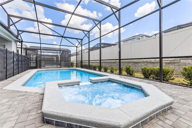 2026 Lelani Cir, Davenport, FL 33897 - view of swimming pool featuring a patio, a pool with connected hot tub, and glass enclosure