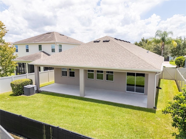 15586 Hamlin Blossom Ave, Winter Garden, FL 34787 - back of property with a fenced backyard, a patio area, stucco siding, and roof with shingles