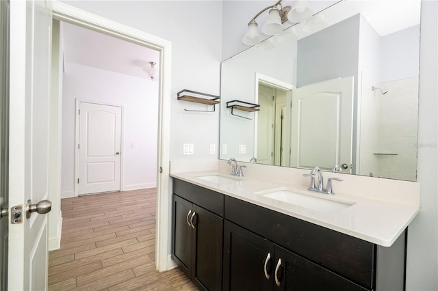 15586 Hamlin Blossom Ave, Winter Garden, FL 34787 - full bathroom with a chandelier, double vanity, and wood finished floors