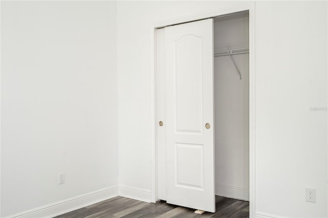 15586 Hamlin Blossom Ave, Winter Garden, FL 34787 - unfurnished bedroom with dark wood-style floors and a closet
