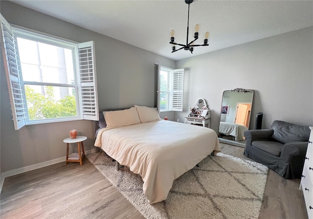 8004 Sweet Orange Ave, Winter Garden, FL 34787 - bedroom with a chandelier and wood finished floors