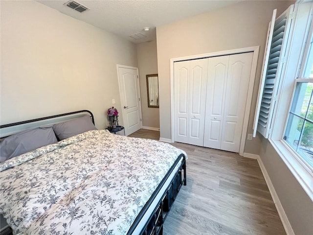 8004 Sweet Orange Ave, Winter Garden, FL 34787 - bedroom featuring wood finished floors and a closet