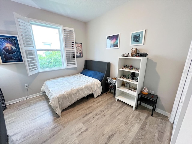 8004 Sweet Orange Ave, Winter Garden, FL 34787 - bedroom with light wood finished floors and baseboards