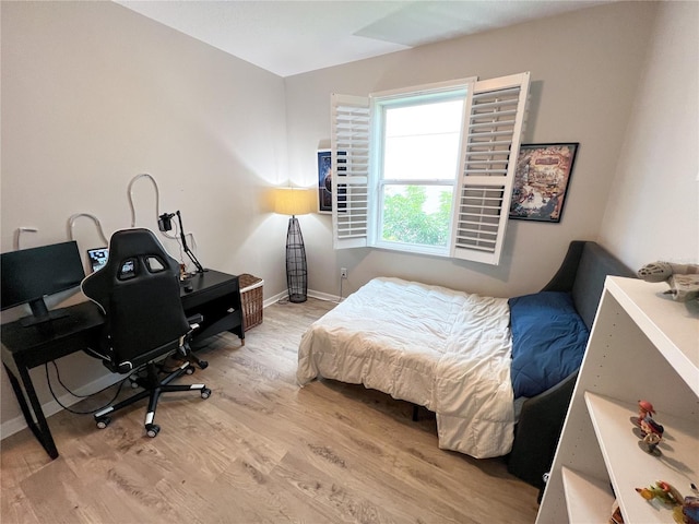 8004 Sweet Orange Ave, Winter Garden, FL 34787 - bedroom featuring light wood-type flooring and a desk