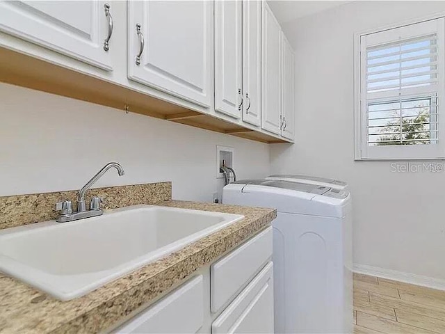 8004 Sweet Orange Ave, Winter Garden, FL 34787 - laundry area with cabinet space and washing machine and clothes dryer