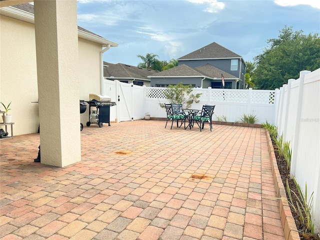 8004 Sweet Orange Ave, Winter Garden, FL 34787 - fenced backyard featuring a patio area, a grill, and outdoor dining area