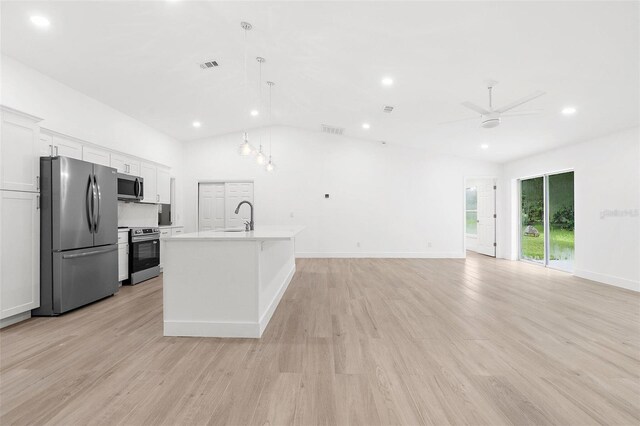 4527 Bamonte St, North Port, FL 34286 - kitchen featuring appliances with stainless steel finishes, recessed lighting, white cabinets, light wood finished floors, and light countertops