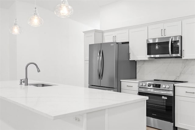 4527 Bamonte St, North Port, FL 34286 - kitchen with stainless steel appliances, decorative backsplash, and white cabinets