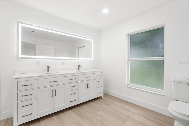 4527 Bamonte St, North Port, FL 34286 - full bath with double vanity, wood finished floors, and recessed lighting