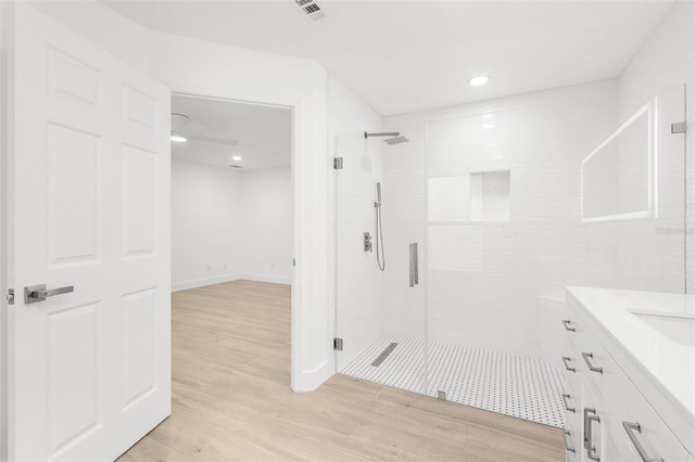 4527 Bamonte St, North Port, FL 34286 - full bath featuring a stall shower, vanity, wood finished floors, and recessed lighting