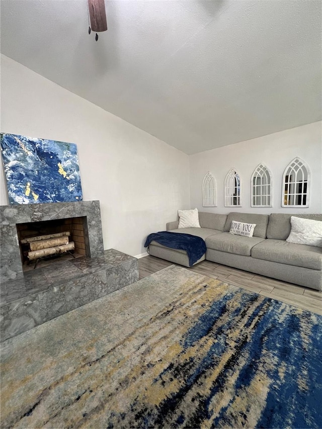 1159 E Winged Foot Cir, Winter Springs, FL 32708 - living room featuring wood finished floors, a ceiling fan, and a fireplace