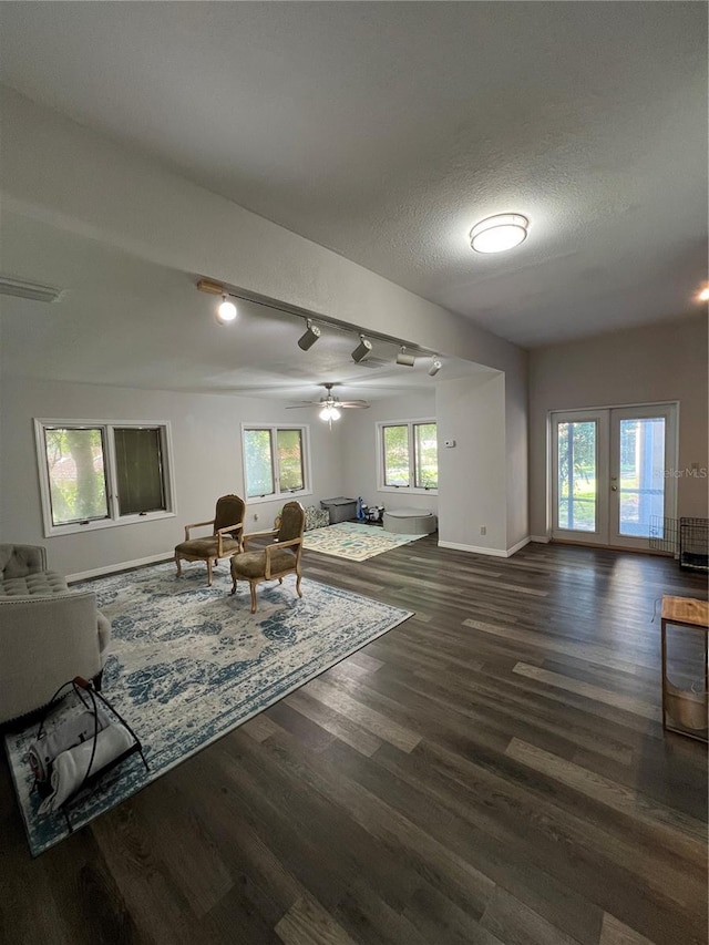 1159 E Winged Foot Cir, Winter Springs, FL 32708 - living room with dark wood-style flooring, healthy amount of natural light, a ceiling fan, and a textured ceiling